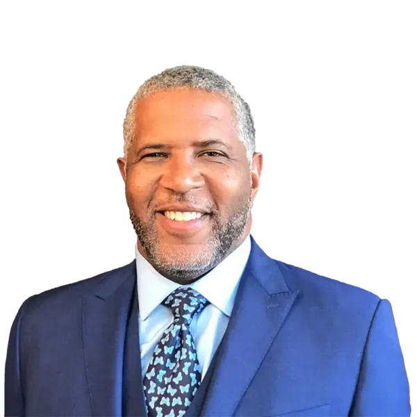 Robert F. Smith wearing a blue suit while smiling.